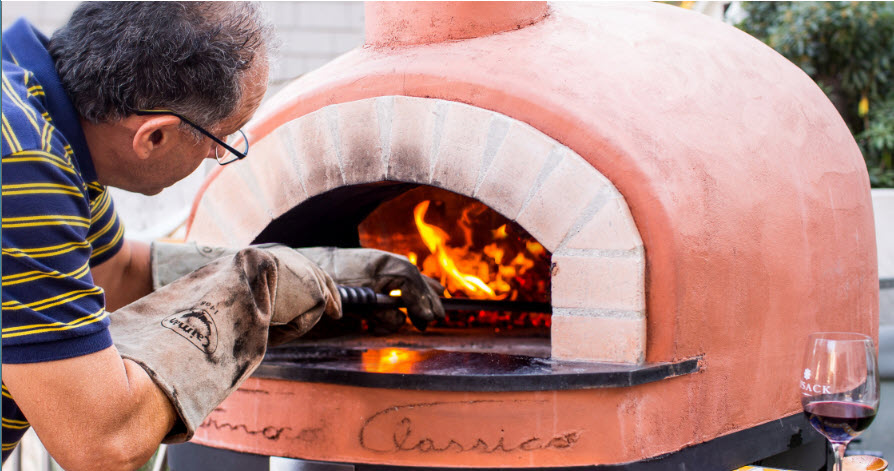 Frank making pizza